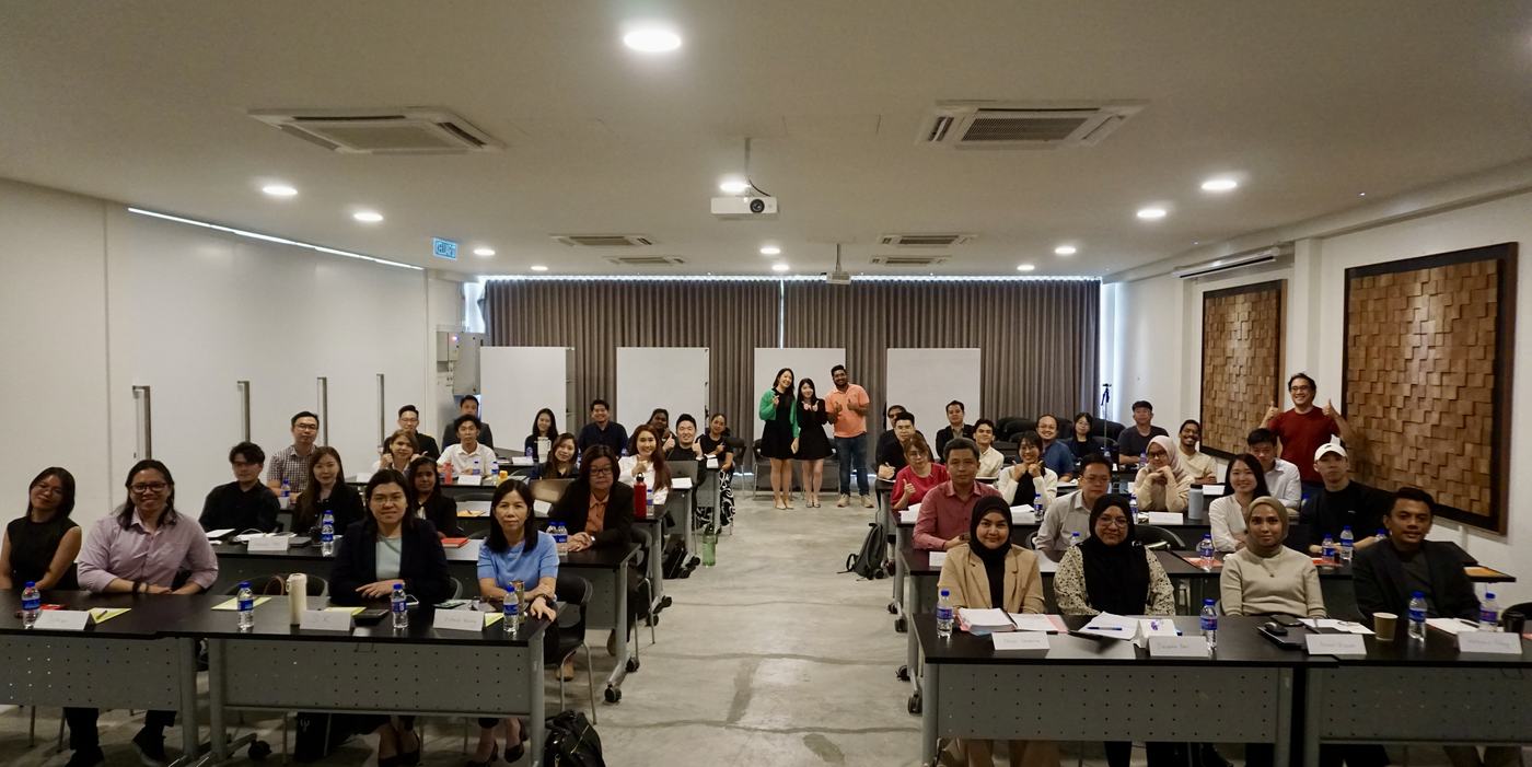 A full training room of participants at a Rise Digital workshop