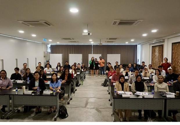 A full training room of participants at a Rise Digital session